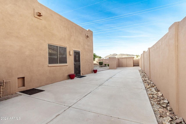 view of property exterior featuring a patio