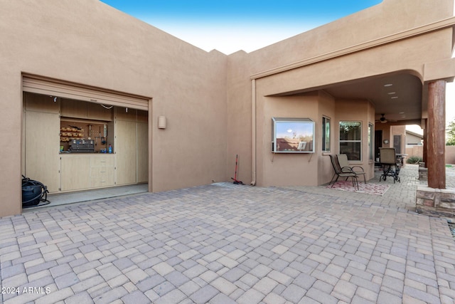 view of patio / terrace featuring ceiling fan