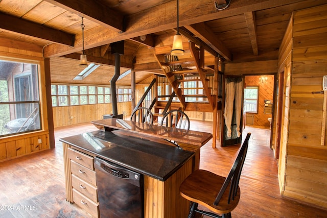 kitchen with wooden ceiling, black dishwasher, wooden walls, and decorative light fixtures