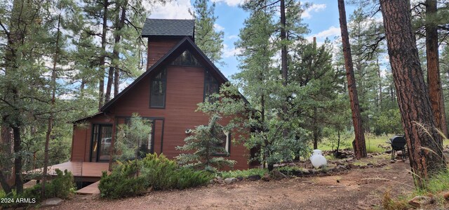 bonus room with vaulted ceiling with beams, wood walls, wood ceiling, and wood-type flooring