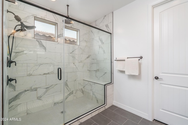 bathroom featuring tile patterned floors and an enclosed shower