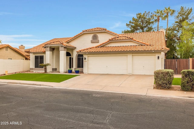 mediterranean / spanish-style house featuring stucco siding, a front lawn, fence, an attached garage, and a tiled roof