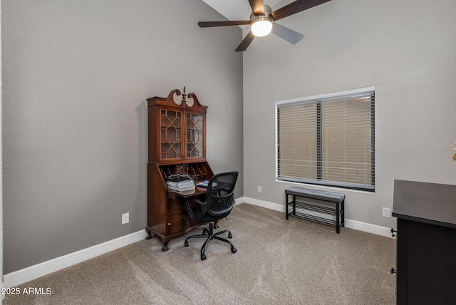 office space featuring a ceiling fan, carpet, and baseboards