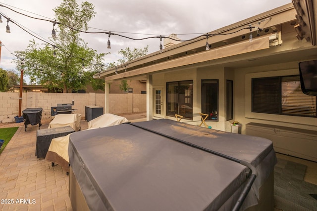 view of patio with outdoor dining space and a fenced backyard