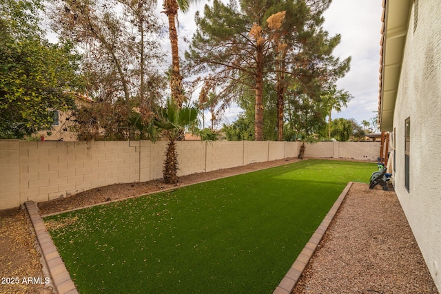 view of yard featuring a fenced backyard