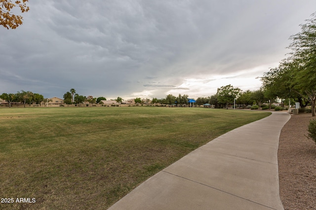 view of property's community featuring a lawn