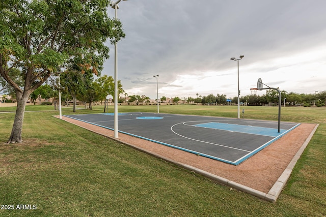 view of basketball court featuring community basketball court and a yard