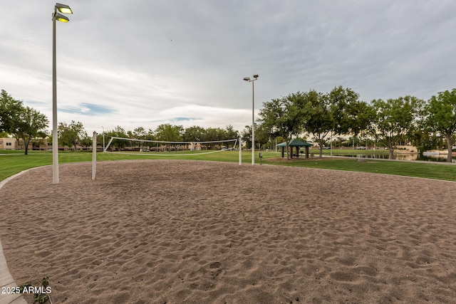 view of home's community with volleyball court, a gazebo, and a yard