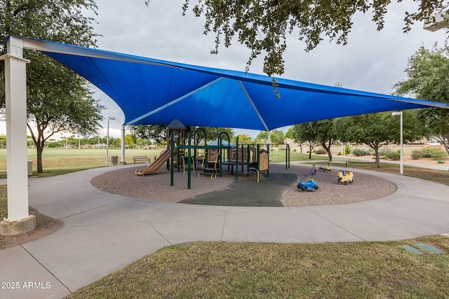 communal playground featuring a yard