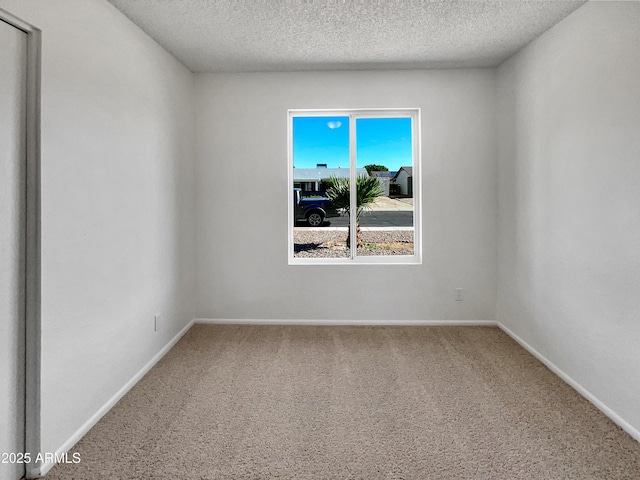 2127 W Marco Polo Rd, Phoenix, AZ 85027 - unfurnished room with carpet floors, a textured ceiling, and baseboards