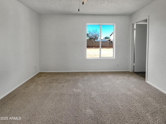 2127 W Marco Polo Rd, Phoenix, AZ 85027 - carpeted spare room with a textured ceiling and baseboards