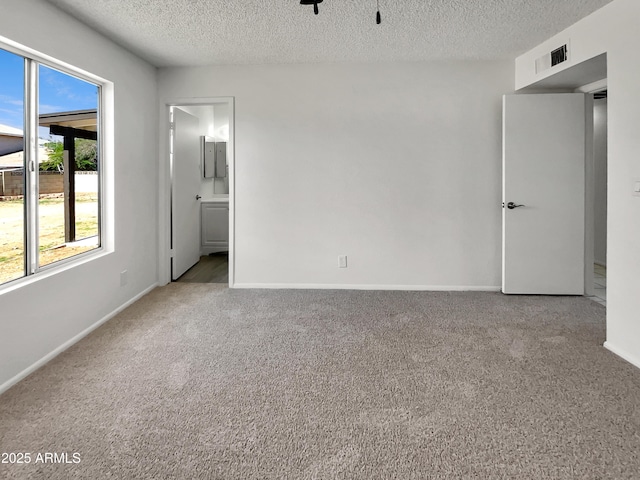 2127 W Marco Polo Rd, Phoenix, AZ 85027 - empty room with carpet flooring, a textured ceiling, and baseboards