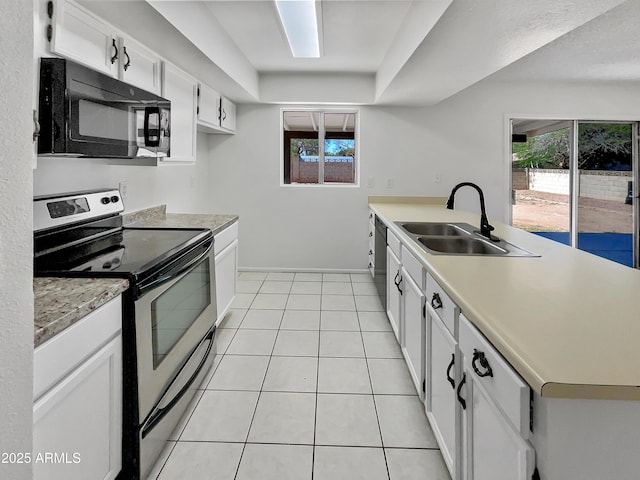 2127 W Marco Polo Rd, Phoenix, AZ 85027 - kitchen featuring black microwave, electric stove, a sink, a peninsula, and light countertops