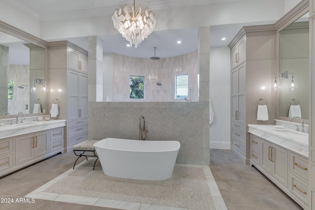 bathroom with vanity, shower with separate bathtub, a chandelier, and tile walls