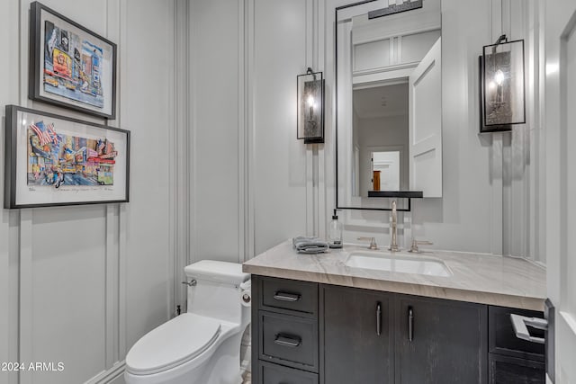 bathroom with vanity and toilet