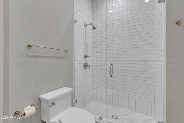 bathroom with toilet and walk in shower