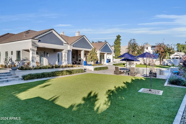 exterior space with a patio and a yard