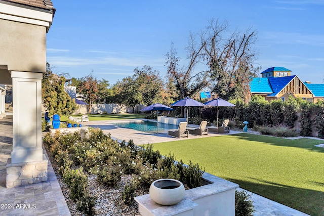 view of yard with a patio and a fenced in pool