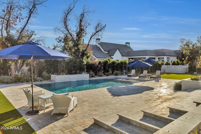 view of swimming pool featuring a patio area and pool water feature