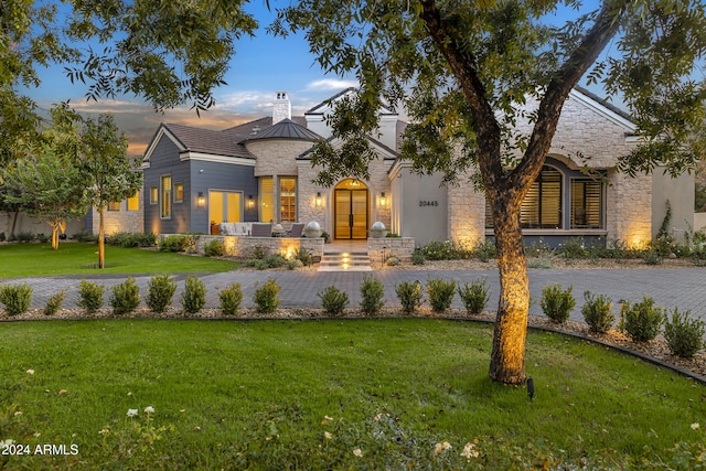 view of front of property with a yard