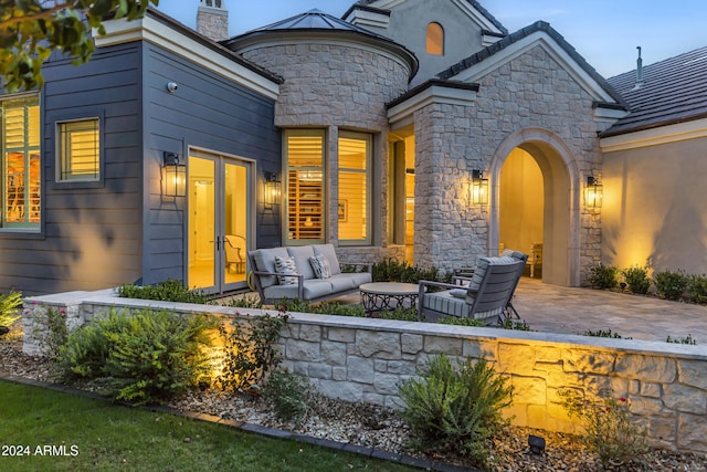 exterior space featuring a patio area and an outdoor hangout area