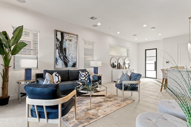 living room with light tile patterned flooring