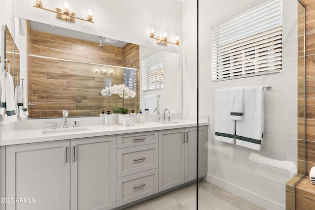 bathroom with tile patterned flooring, vanity, and a shower with shower door