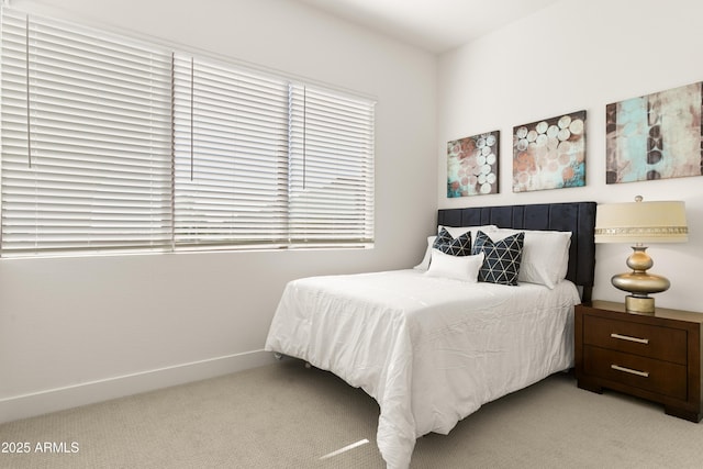 bedroom with light colored carpet