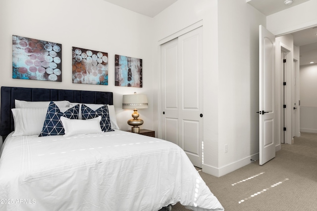 bedroom featuring light carpet and a closet