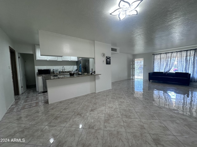 4232 W Citrus Way, Phoenix, AZ 85019 - living room with a textured ceiling and a chandelier