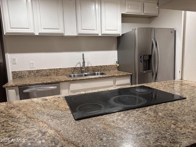 4232 W Citrus Way, Phoenix, AZ 85019 - kitchen featuring stainless steel appliances, a sink, white cabinetry, and dark stone counters