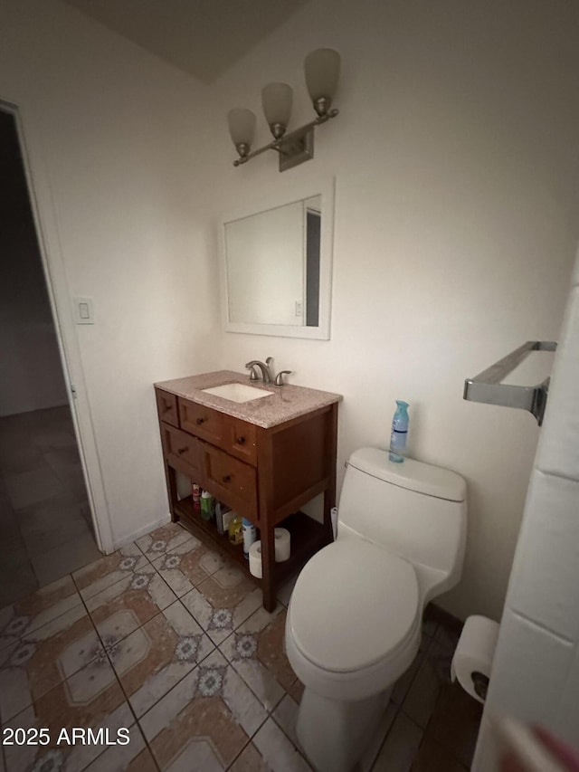 4232 W Citrus Way, Phoenix, AZ 85019 - half bath featuring vanity, toilet, and tile patterned floors