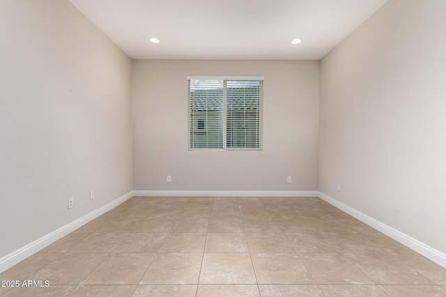 unfurnished room with light tile patterned floors