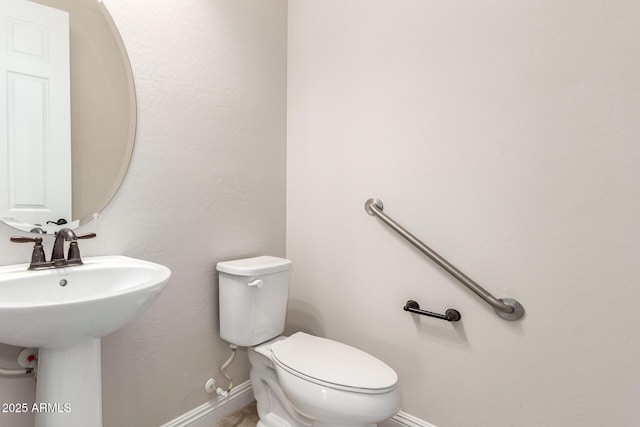 bathroom with toilet and sink