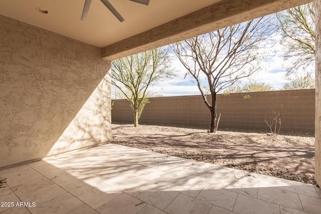 view of patio featuring ceiling fan