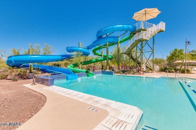 view of pool with a water slide