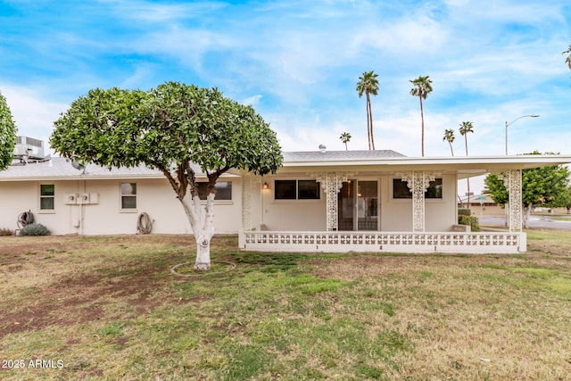 single story home with a front lawn and central AC