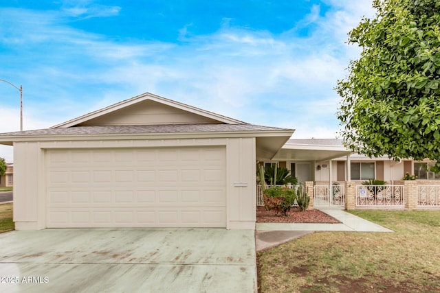 ranch-style home with concrete driveway, an attached garage, and fence