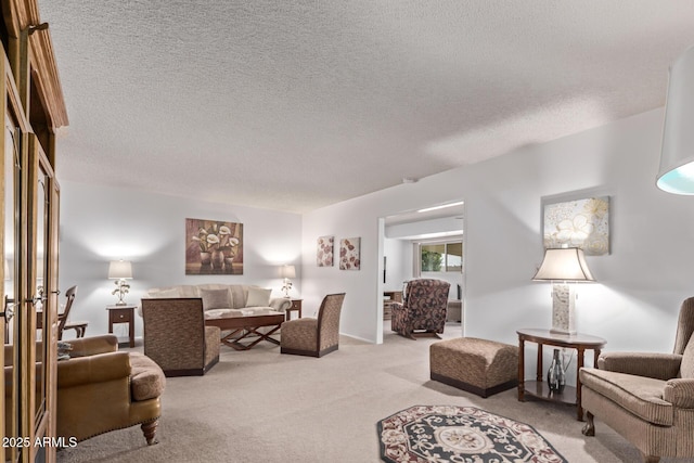 living room featuring carpet floors and a textured ceiling