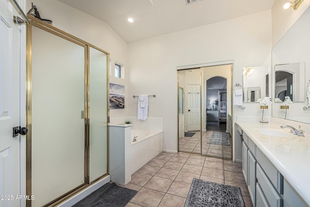 6846 S 26th Pl, Phoenix, AZ 85042 - full bath featuring a garden tub, a stall shower, vanity, connected bathroom, and tile patterned floors