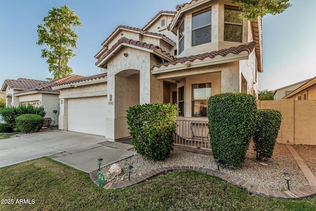 6846 S 26th Pl, Phoenix, AZ 85042 - view of front facade featuring stucco siding, a garage, a tile roof, and driveway