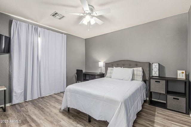6846 S 26th Pl, Phoenix, AZ 85042 - bedroom featuring wood finished floors and a ceiling fan