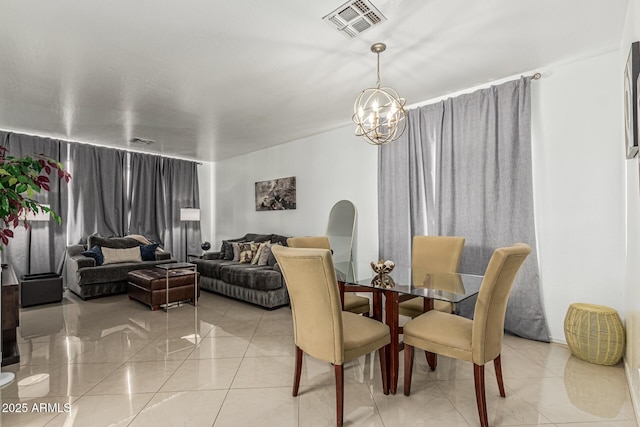 6846 S 26th Pl, Phoenix, AZ 85042 - dining space with light tile patterned floors and a chandelier