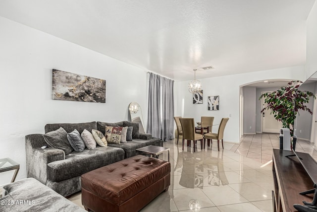 6846 S 26th Pl, Phoenix, AZ 85042 - living area featuring arched walkways, a chandelier, and light marble finish floors