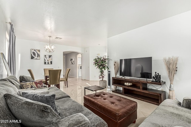 6846 S 26th Pl, Phoenix, AZ 85042 - living area featuring arched walkways and a chandelier
