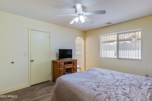 bedroom featuring ceiling fan and dark wood-type flooring