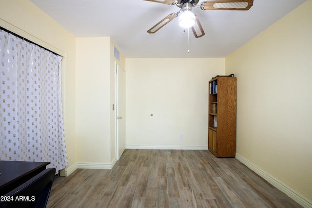 unfurnished bedroom featuring light hardwood / wood-style floors and ceiling fan