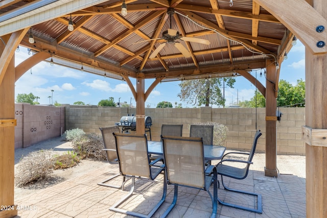 view of patio / terrace with a gazebo, area for grilling, and ceiling fan