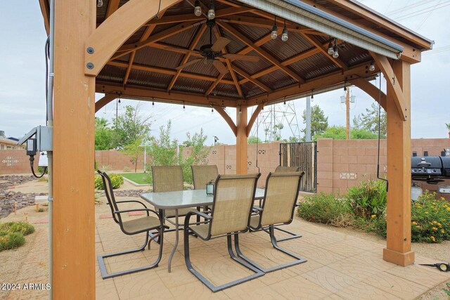 view of patio / terrace with ceiling fan and a gazebo