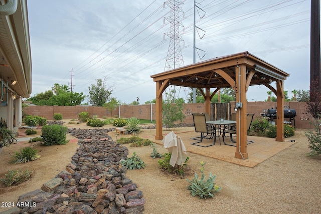 view of yard featuring a gazebo and a patio area